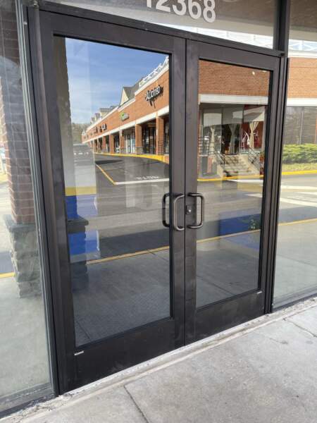 New double entry doors with new continuous hinges installed by commercial door repair company