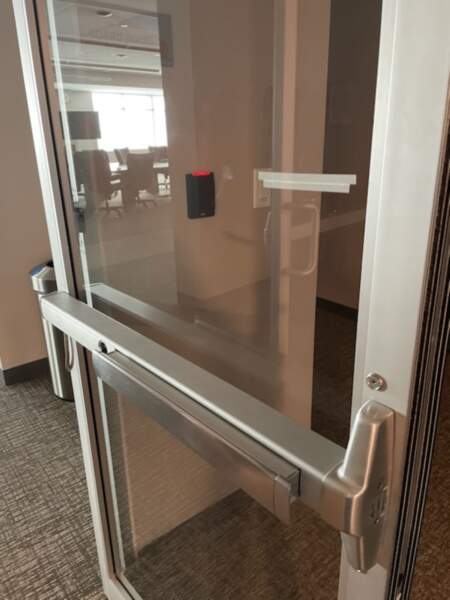 A new panic exit device installed by commercial door repair technicians