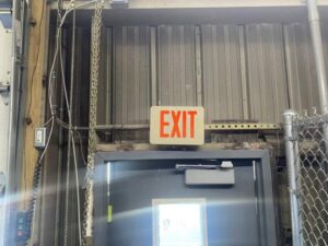 Broken Exit Door to be replaced by commercial door repair company